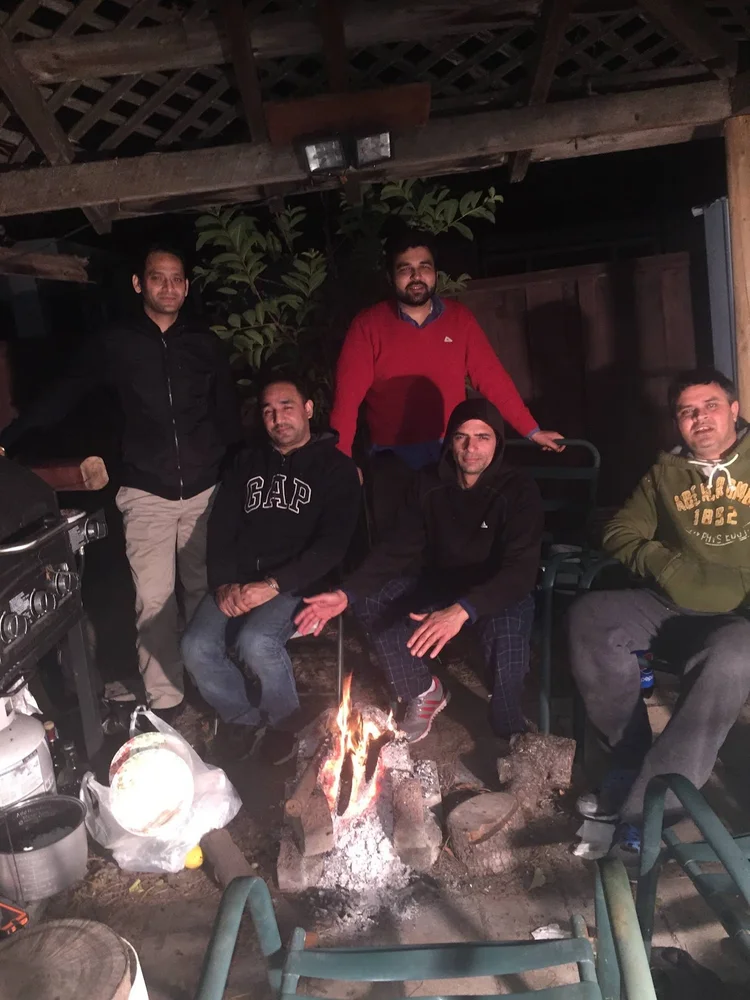 The Shubham Story 3 Friends gathered around a fire during an evening together